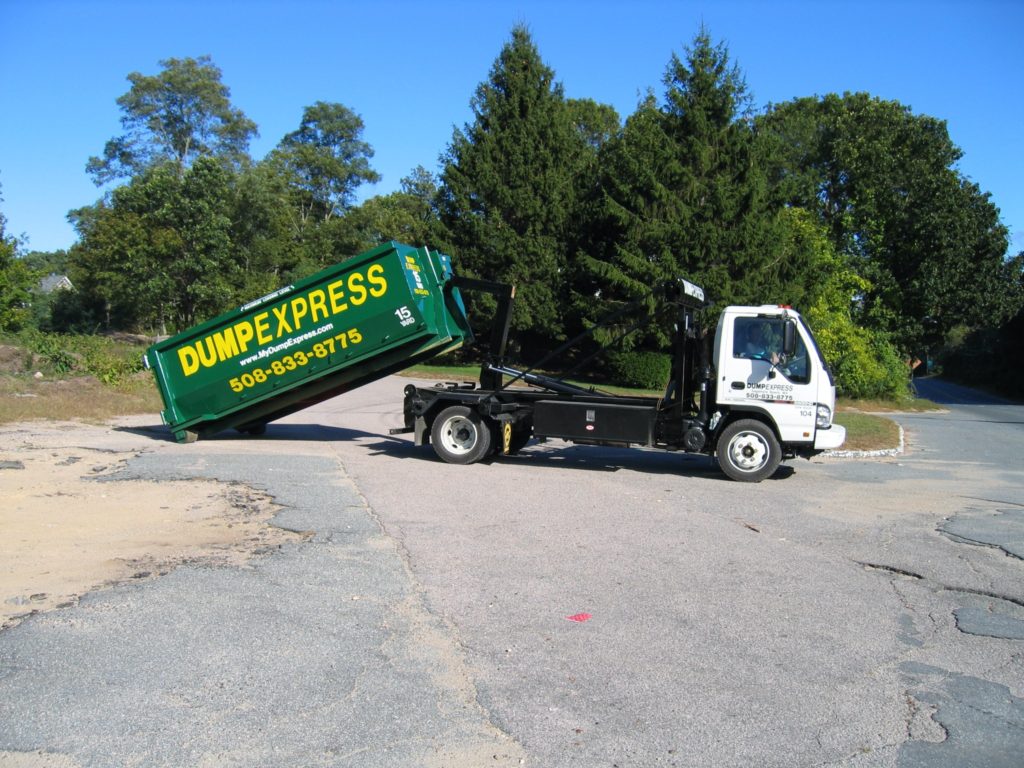 Dumpster rental cape cod truck unloading dumpster